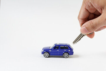 Concept for car and security , The toy blue car and key for security.
