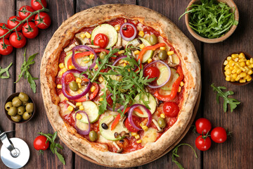 Flat lay composition with vegetable pizza on wooden table
