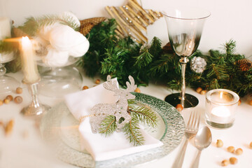 Festive table setting for Christmas and New Year. Soft focus.