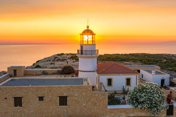 The lighthouse on Gavdos island at sunset, Crete, Greece. © gatsi