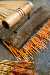 Fast food on sticks cooked on a chinese street market