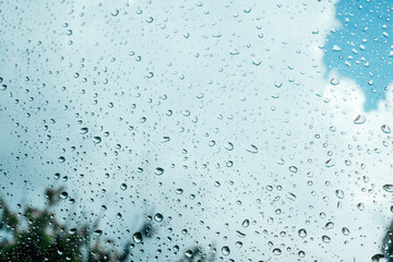Rain drops on window pane glass surface