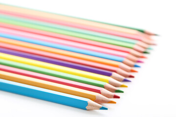 Colored pencils on white background