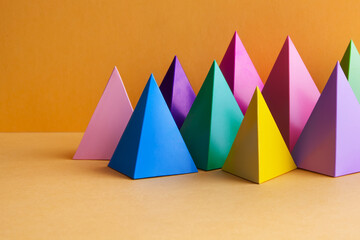 Colorful geometric abstract still life composition. Bright prism pyramid triangle shape figures....
