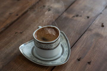 hot turkish coffee cup on wood table 