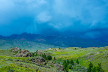 Fototapeta premium Majestic mountain landscape, cloudy sky before a thunderstorm.