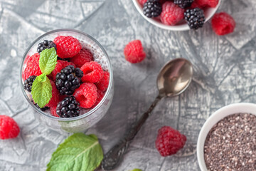 Vegan healthy food. Chia pudding with coconut milk, fresh raspberries and blackberries