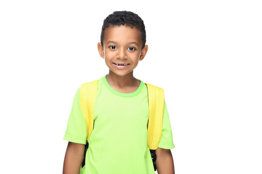Young African American school boy with backpack on white background