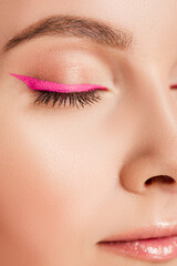 close up view of beautiful woman with pink eyeliner - obrazy, fototapety, plakaty