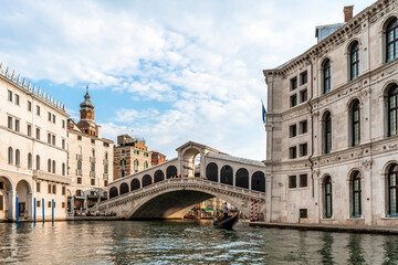 Fototapeta na wymiar The beautiful Rialto bridge in the city of Venice in Italy seen from the boat.