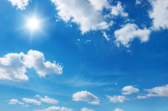 Blue sky with clouds and sun. © oleh11