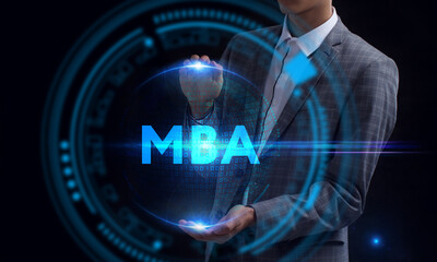 Business, Technology, Internet and network concept. Young businessman working on a virtual screen of the future and sees the inscription: MBA