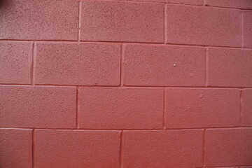 Red painted cinder block wall full frame 
