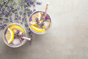 Fresh delicious lemonade with lavender on grey table, flat lay. Space for text