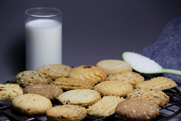milk and cookies on Gray Background.