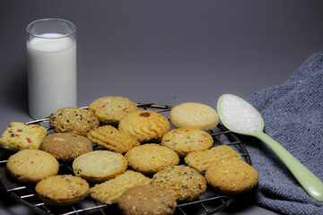 cookies and glass of milk on gray background. 