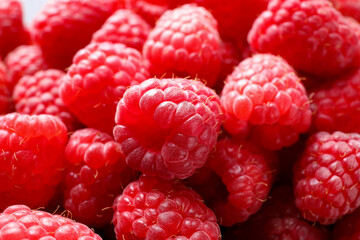 Fresh sweet ripe raspberries as background, closeup