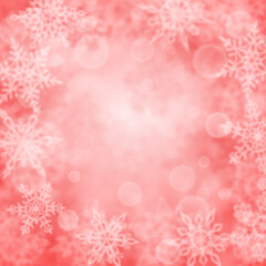Christmas background of blurry snowflakes in pink colors