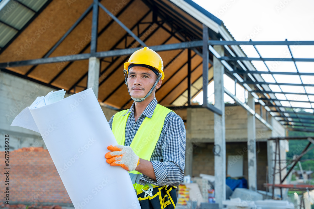Aufkleber Foreman with blueprint are working about project in building construction site.