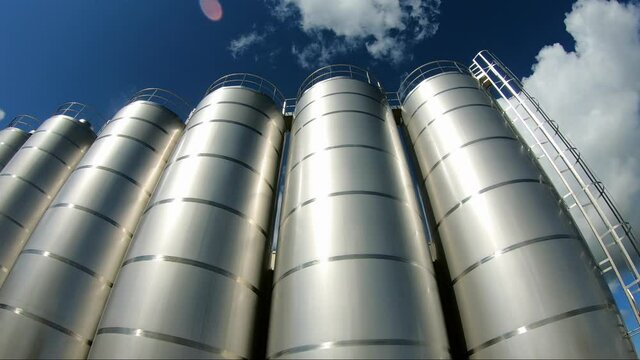 Milk storage tank at a dairy plant.. Tankers with milk in the unloading zone