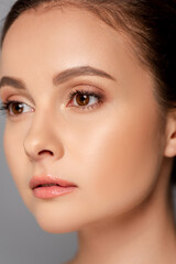 Fototapeta premium portrait of beautiful woman with perfect skin isolated on grey