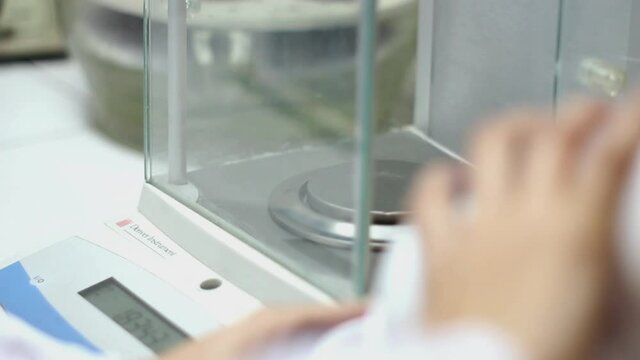 Performing a weighing in a cellar laboratory