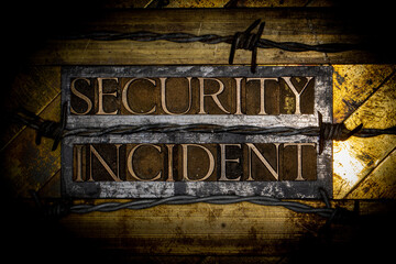 Security Incident text formed with real authentic typeset letters on vintage textured silver grunge copper and gold background