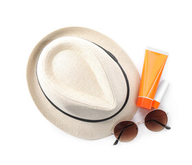 Sun protection products, sunglasses and hat on white background, top view. Beach objects