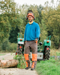 Man standing in front of tractor