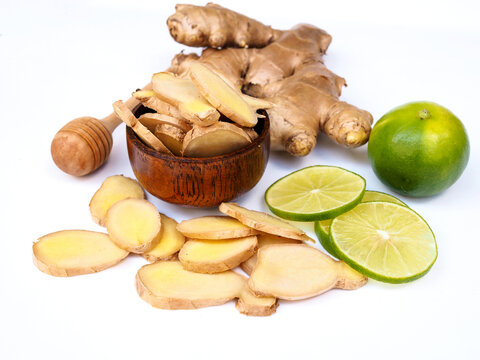 herbs and spices with ginger root and lime lemon citrus and honey isolated on white background.