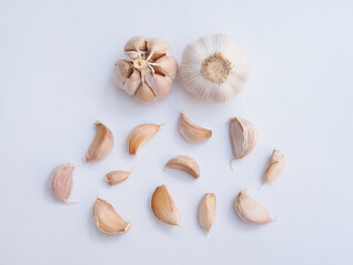 Top view of herbs and spices with garlic isolated on white background.