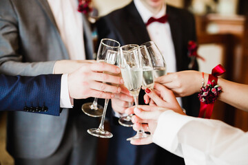 Gorgeous wedding couple enjoys champagne in the ceremony