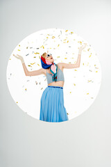 Cheerful woman in sunglasses and headscarf standing under falling confetti in circle on white background