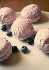 background with pink marshmallows and blueberries close up
