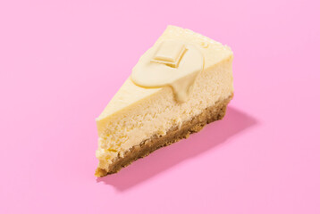 Cheesecake slice with white chocolate topping. One slice of cheesecake close-up