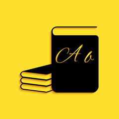 Black ABC book icon isolated on yellow background. Dictionary book sign. Alphabet book icon. Long shadow style. Vector.