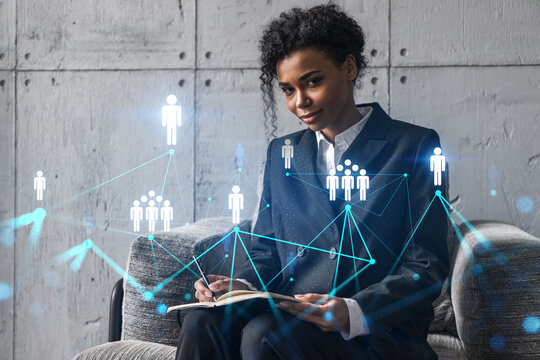 Businesswoman typing on laptop work in modern office on new project. Social network icon drawing hologram. Double exposure. Concept of success.