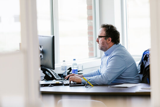 Mature Man Working In Office