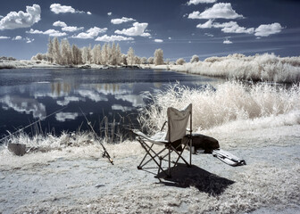 summer landscape, infrared photo snowy tree amazing nature, fishing equipment on the lake shore, unusual surreal view, infrared photography