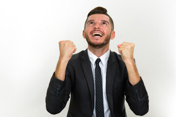 Portrait of handsome bearded Hispanic businessman in suit