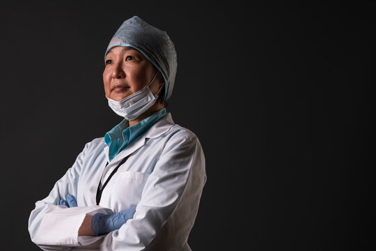 Portrait of medical researcher wearing protective cap and face mask