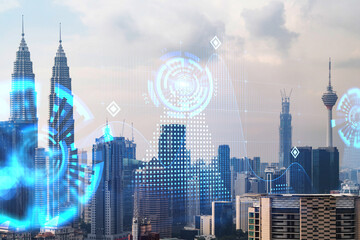 Abstract technology icons hologram over panorama city view of Kuala Lumpur, Malaysia, Asia. The...