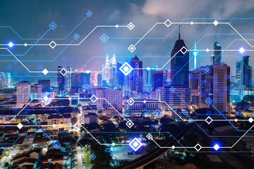 Information flow hologram, night panorama city view of Kuala Lumpur. KL is the largest technological center in Malaysia, Asia. The concept of programming science. Double exposure.