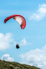paragliding in the blue sky