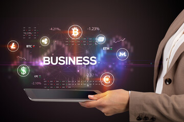 Close-up of a touchscreen with BUSINESS inscription, business opportunity concept