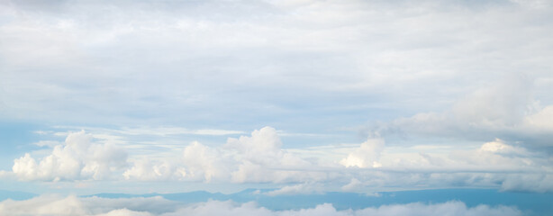Beautiful blue sky with white fluffy clouds.