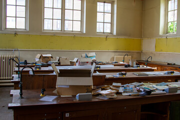 Abandoned School Building - desks in a science lab