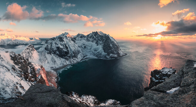 Panorama of Sunset over Ryten mountain and Kvalvika beach in winter at Lofoten Islands