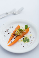 Braised Carrot with Sour Cream, White Fish Roe and Petals. Modern Cuisine