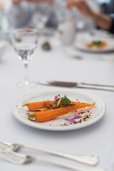 Braised Carrot with Sour Cream, White Fish Roe and Petals. Modern Cuisine